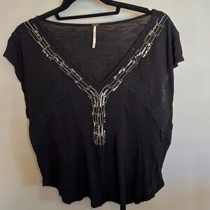 Free People top. Medium. Black embellished v neck. M.